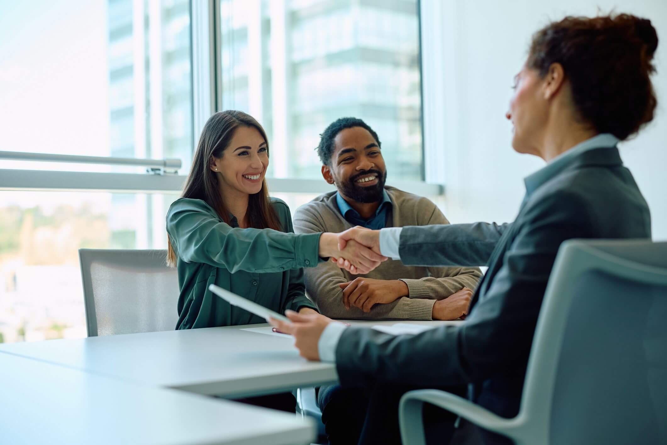 Handshake during a business meeting in office.