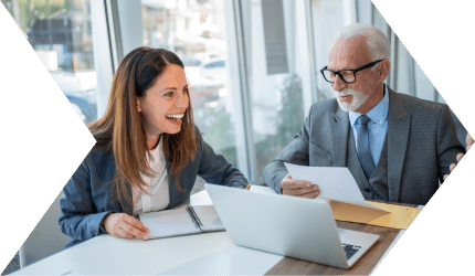 Business meeting with two colleagues smiling.